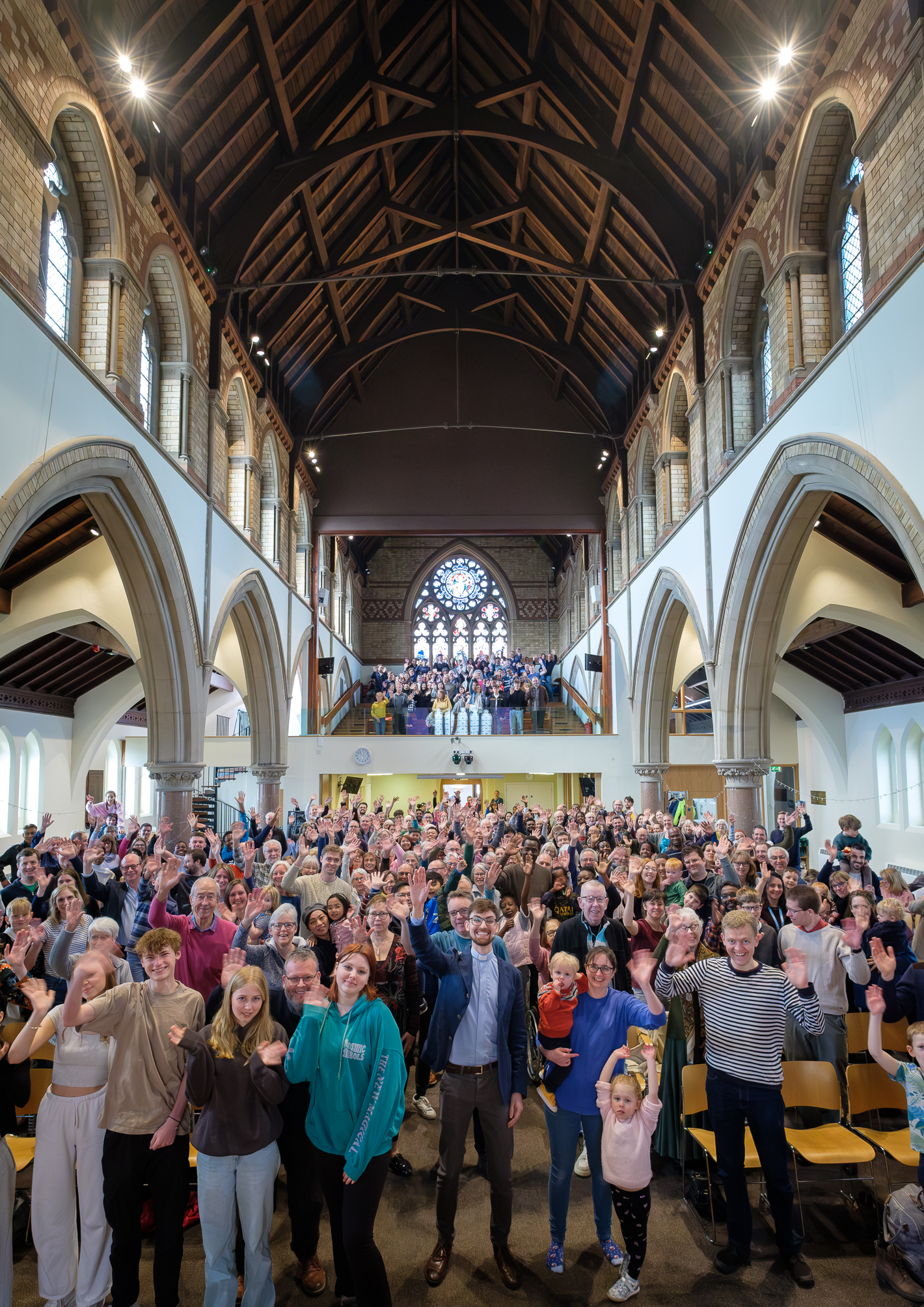 St Paul's congregation standing and waving