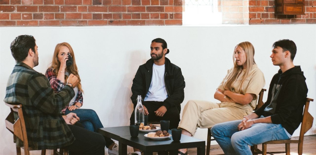 Group of people sitting round a table