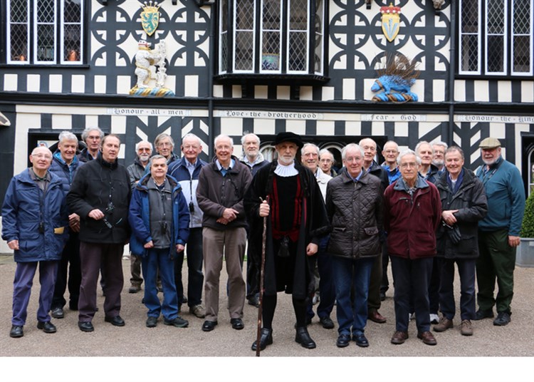 Group of men outside a building